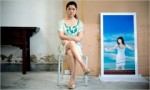 The Chinese artist Cui Xiuwen in her studio in Beijing next to a print that is part of a triptych titled “Angel No. 9,” from 2006.